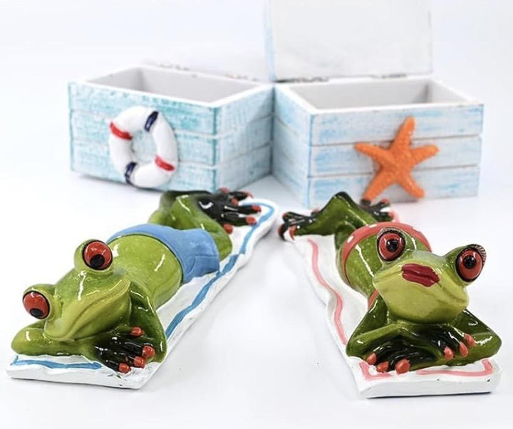 Cute Frogs Lying On The Beach RAQ626